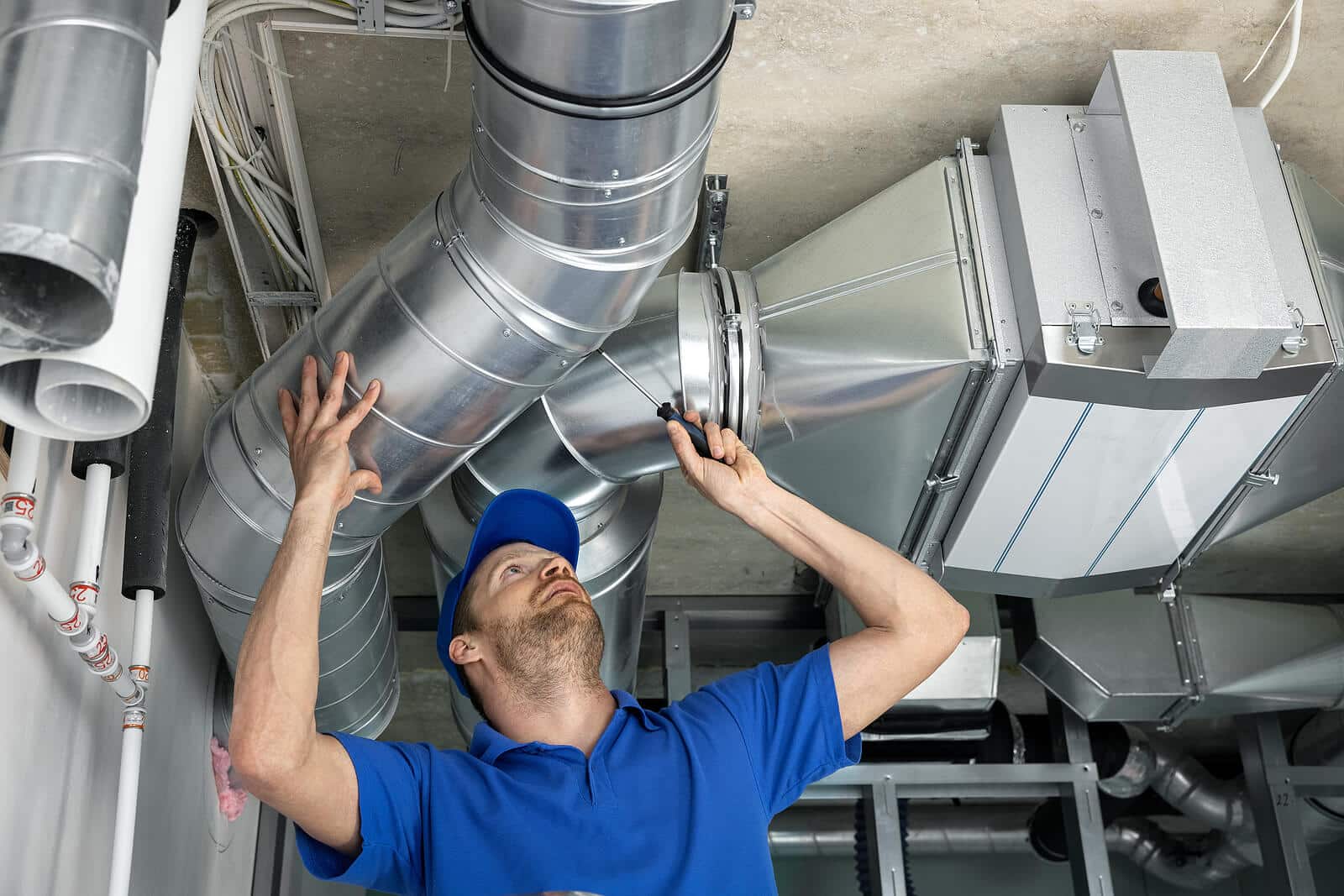 HVAC technician inspecting and repairing air ducts in Campbell