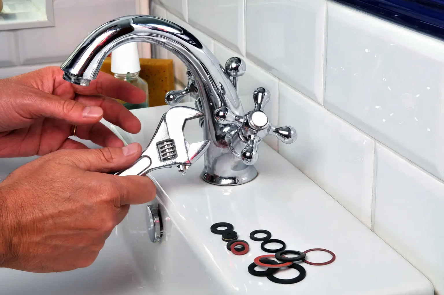 Plumber maintaining a bathroom faucet in Campbell