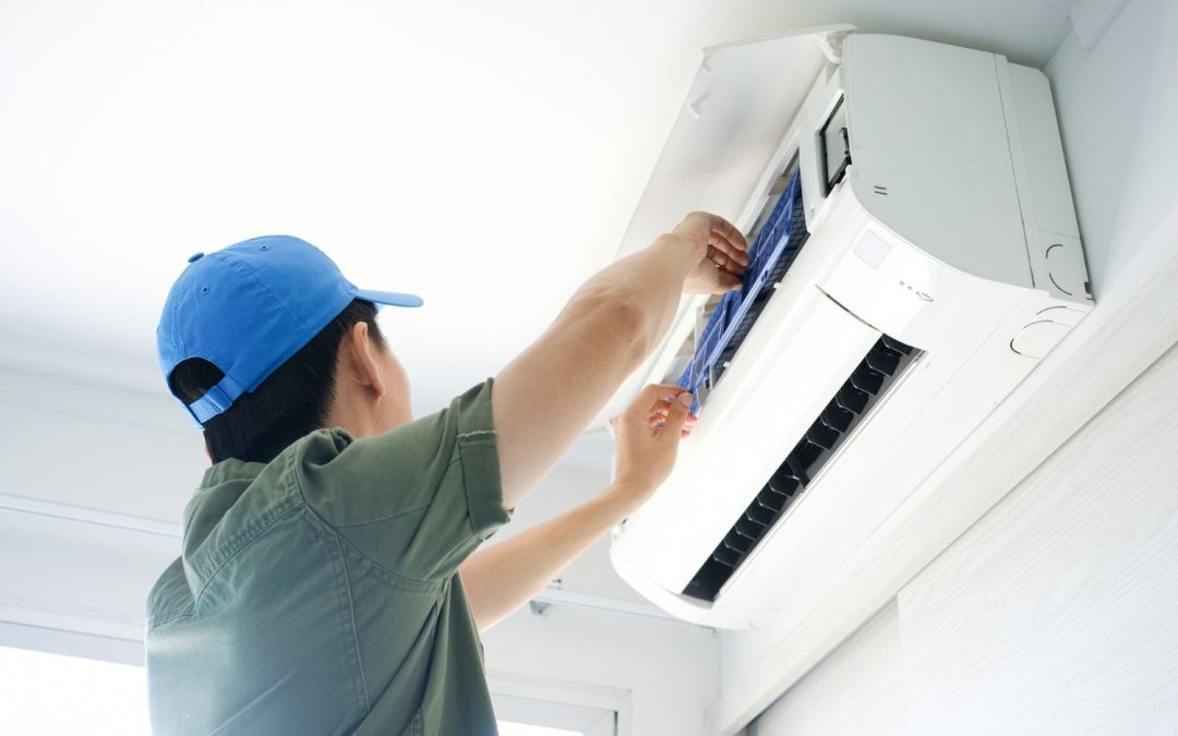 HVAC technician servicing a ductless mini split in Campbell