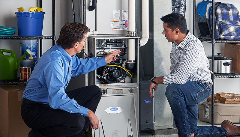 Technician evaluating a furnace for repair or replacement in Campbell