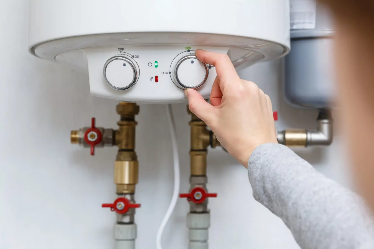 Technician adjusting a water heater in Campbell